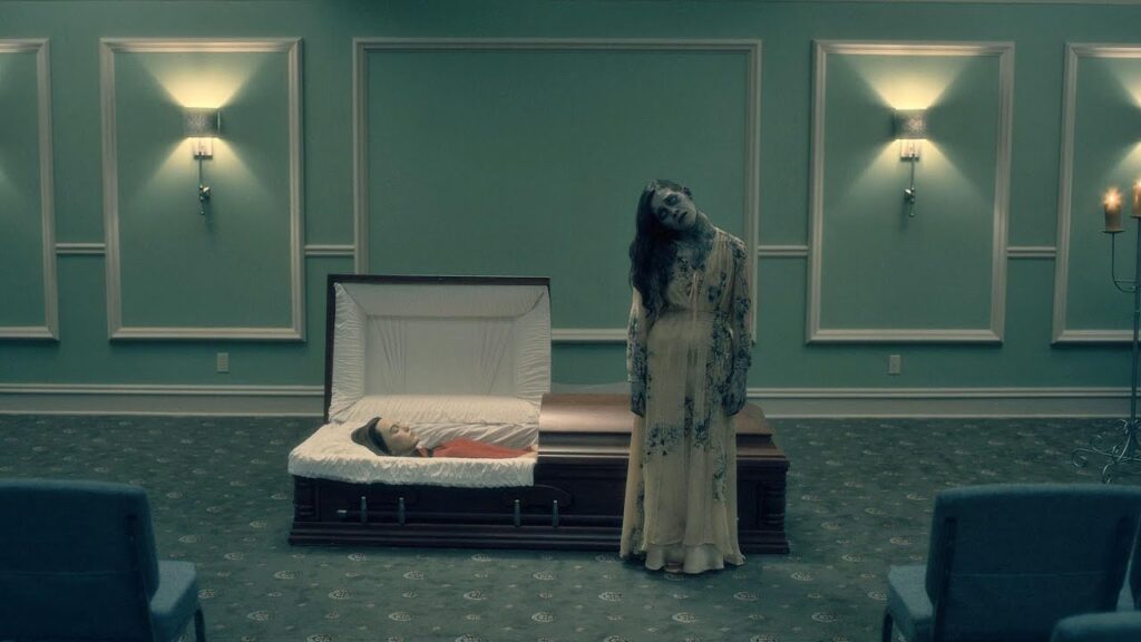 The Bent-Neck Lady: A Ghost Across Time and Death