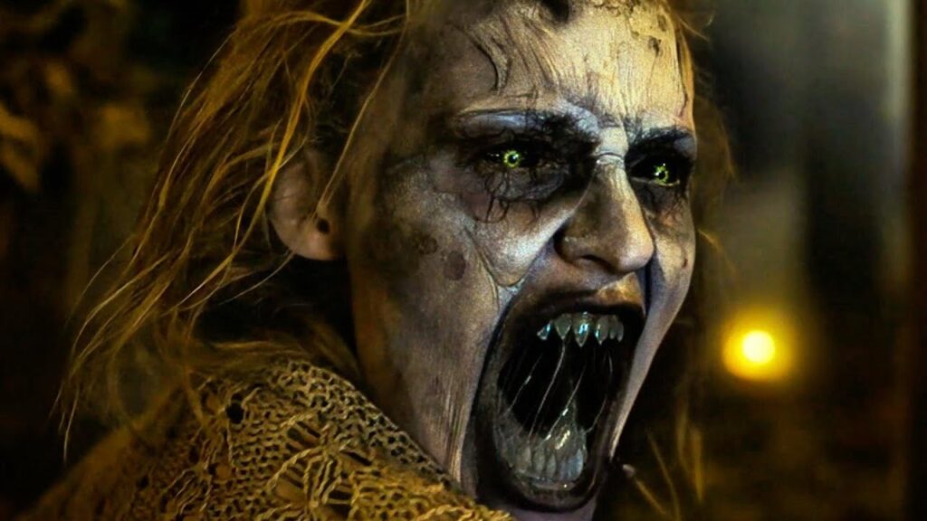 The cursed lake bride reveals her monstrous form, dragging victims into the abyss of eternal horror