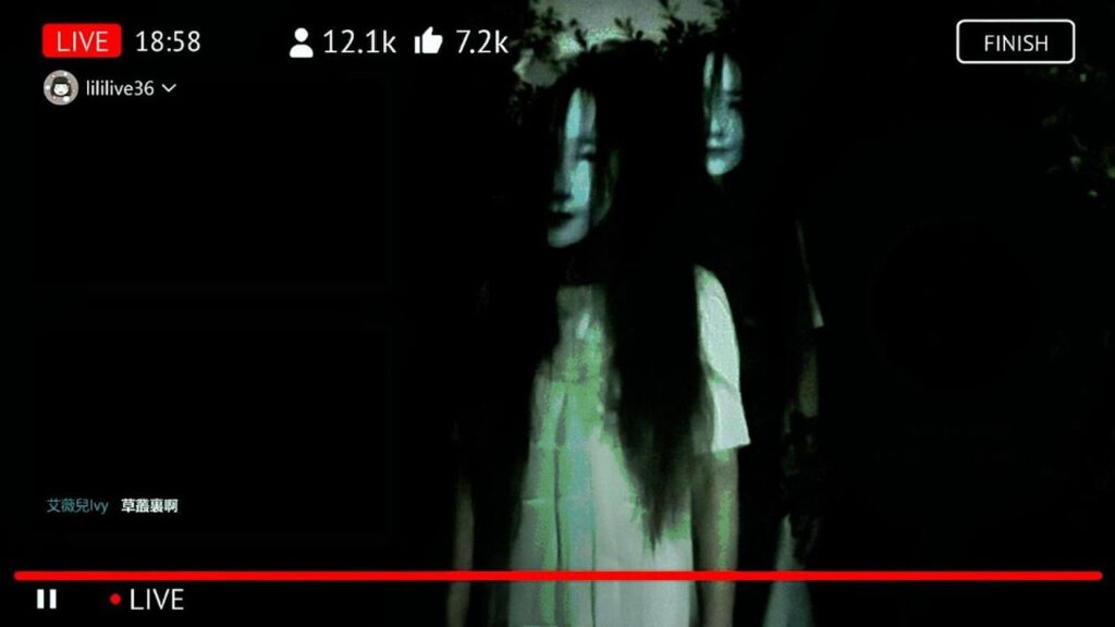 While the influencer is live, her 12K viewers all watch the two ghostly figures standing behind her.