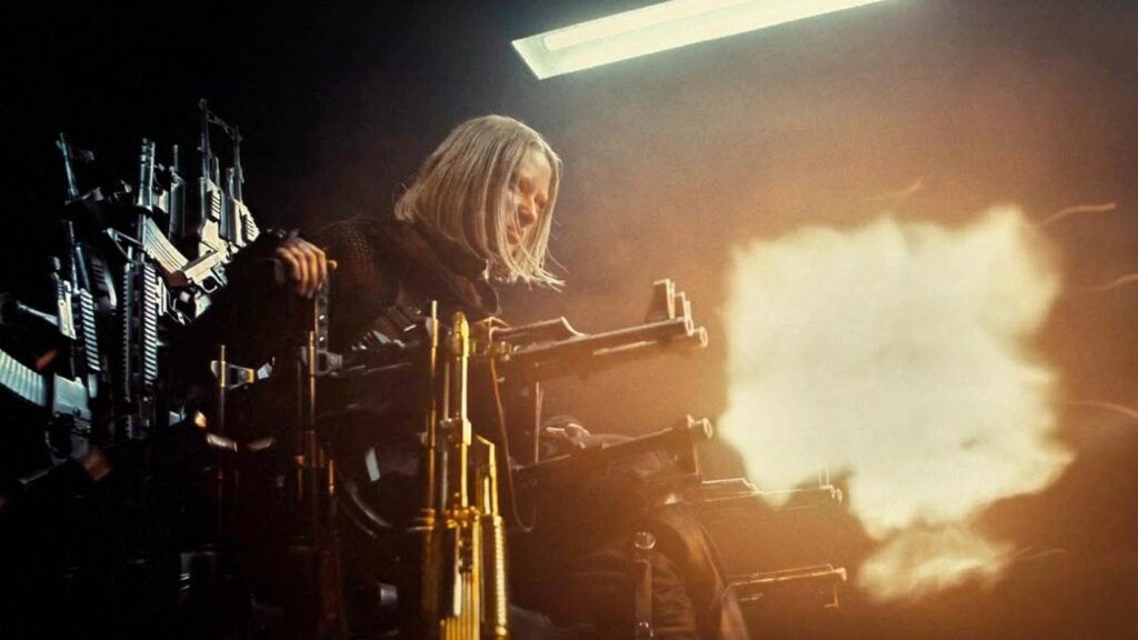 She kills her father, seizes the gun-throne, and becomes the new queen of the wasteland.